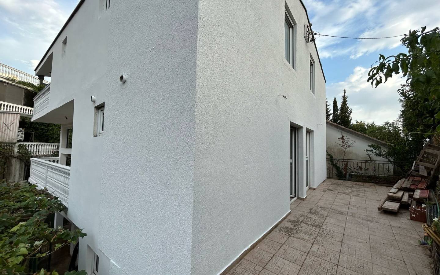 Modern two-story white property with patio in Ulcinj, Montenegro&mdash;ideal investment from immorenta.me by ekosphere doo.