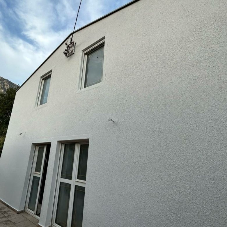 Modern two-story white residence in Ulcinj, Montenegro with mountain views&mdash;ideal investment on immorenta.me by ekosphere doo.