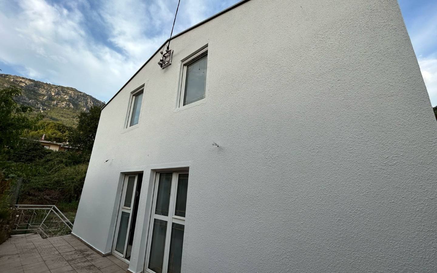 Modern two-story white residence in Ulcinj, Montenegro with mountain views&mdash;ideal investment on immorenta.me by ekosphere doo.