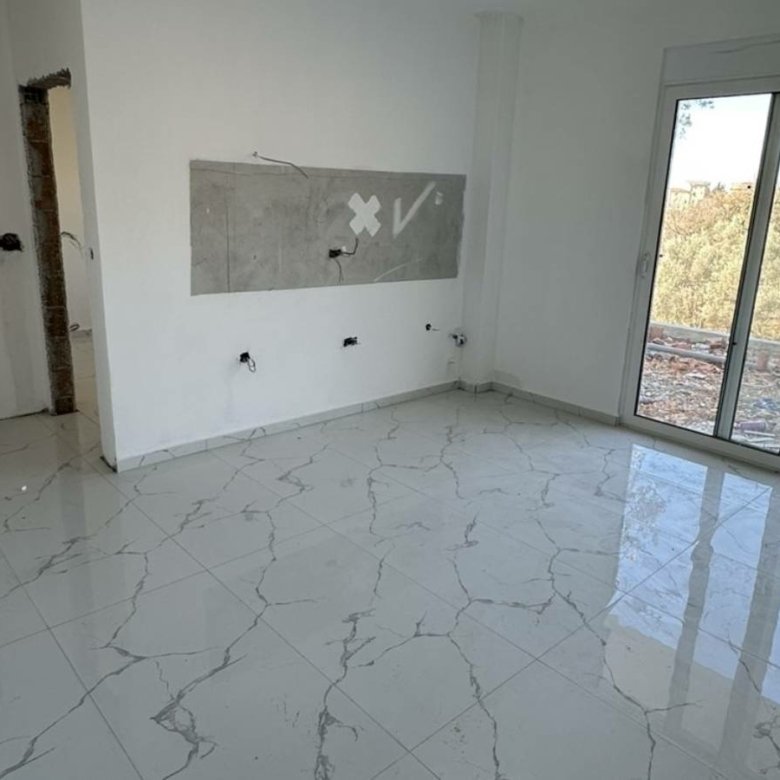 Modern Ulcinj property: bright white walls, marble tiles, glass doors, kitchen-ready space&acirc;exclusive at immorenta.me by Ekosphere doo.