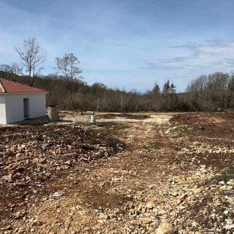 Charming white single-story house with red-tiled roof on a cleared plot in Ulcinj, Montenegro&mdash;ideal property investment. By ekosphere doo.