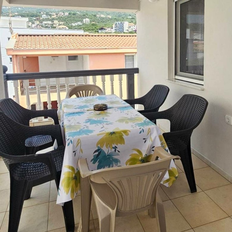 Spacious covered balcony in Ulcinj: table, six chairs. Ideal for relaxing or investors. Montenegro-listings.me by Ekosphere doo.