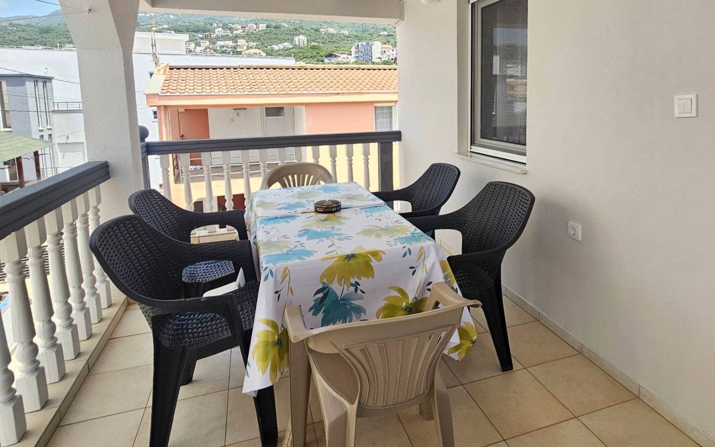 Spacious covered balcony in Ulcinj: table, six chairs. Ideal for relaxing or investors. Montenegro-listings.me by Ekosphere doo.