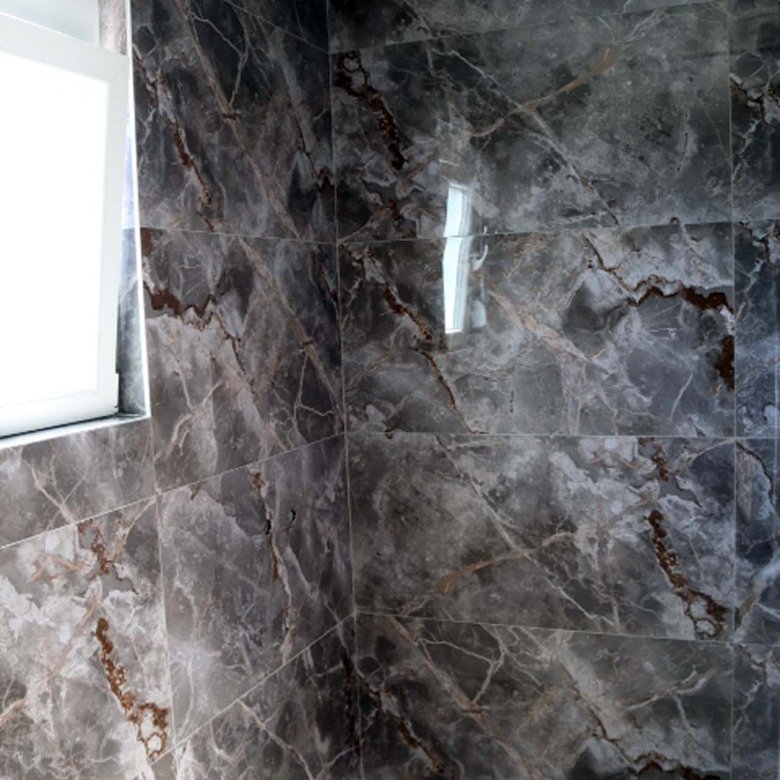 Luxurious Adana Villa shower with marble tiles, niche, frosted window&mdash;premium Ulcinj real estate on immorenta.me by ekosphere doo.