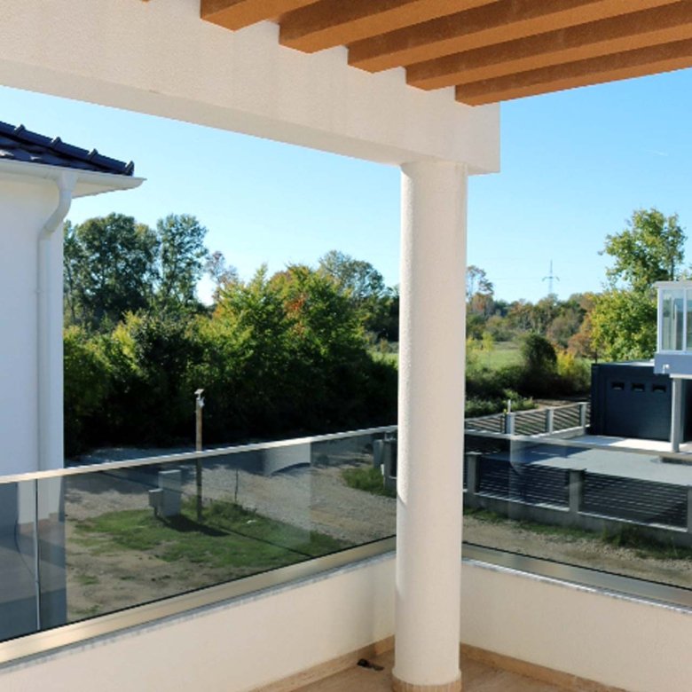 Experience luxury living in Ulcinj with this Adana Villa balcony&mdash;wooden slat ceiling, glass railings, and stunning views. Offered by immorenta.me, a project of ekosphere doo.