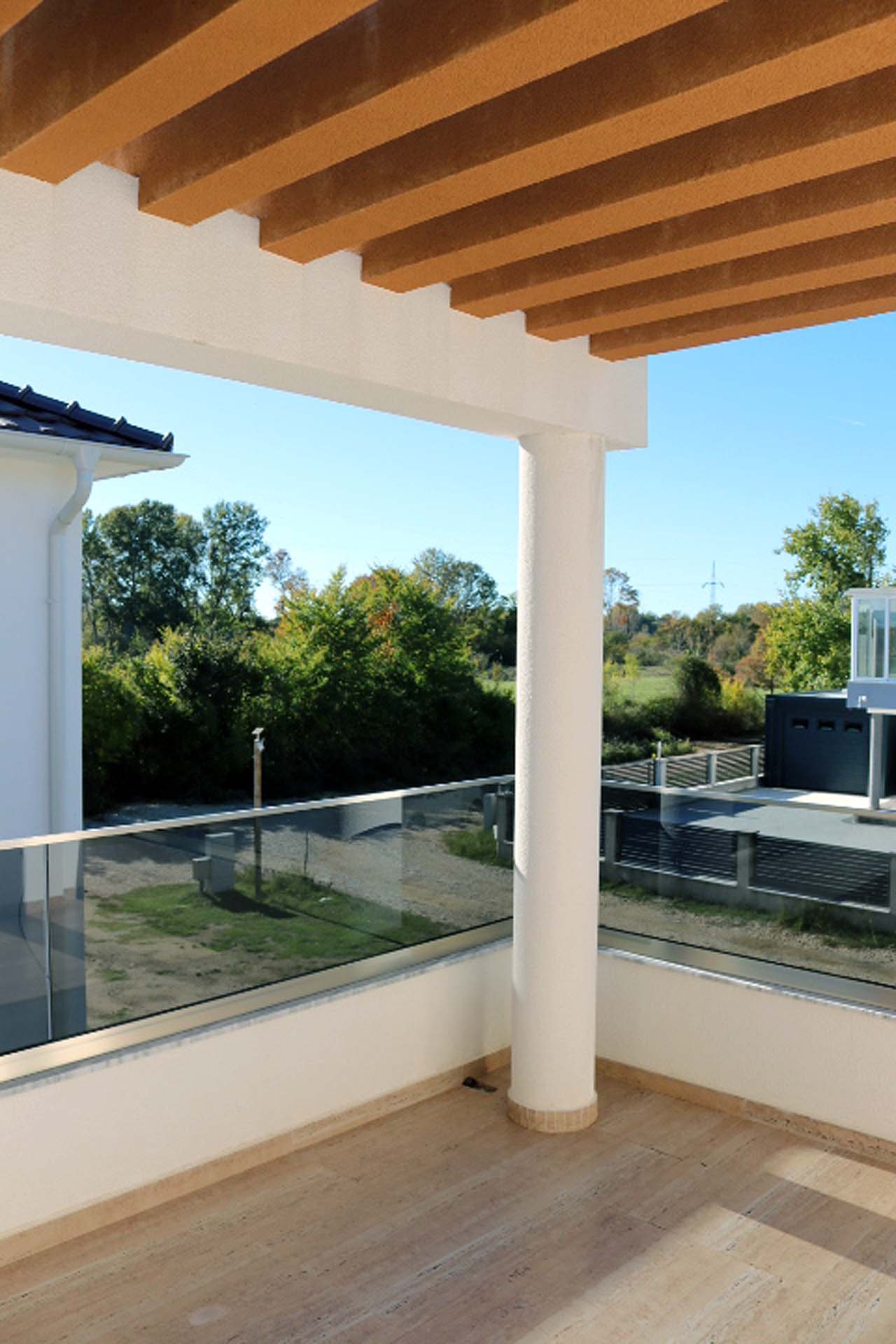 Experience luxury living in Ulcinj with this Adana Villa balcony&mdash;wooden slat ceiling, glass railings, and stunning views. Offered by immorenta.me, a project of ekosphere doo.