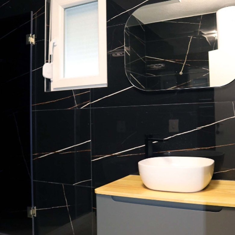 Experience luxury living in Ulcinj with this modern Adana Villa bathroom&mdash;elegant marble walls, stylish fixtures, and natural light.