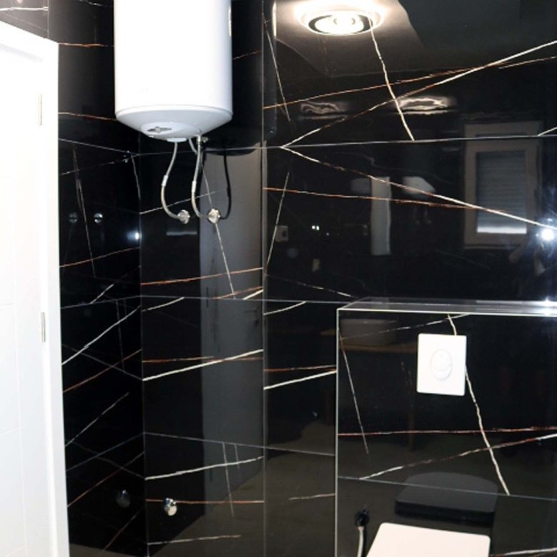 Luxury Adana Villa bathroom with striking black marble, modern fixtures, and premium finishes&mdash;exclusive Ulcinj investment by ekosphere doo.