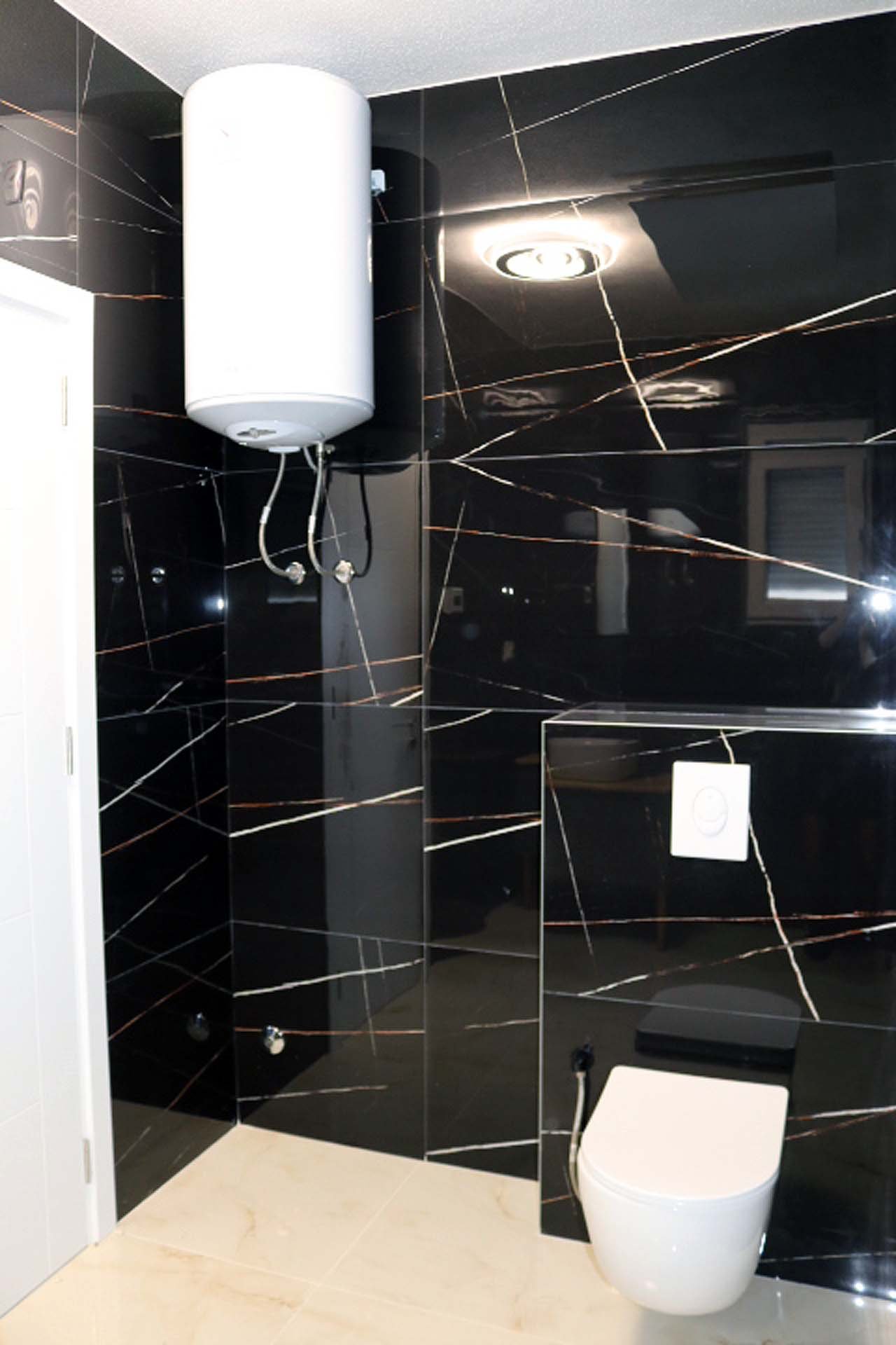 Luxury Adana Villa bathroom with striking black marble, modern fixtures, and premium finishes&mdash;exclusive Ulcinj investment by ekosphere doo.