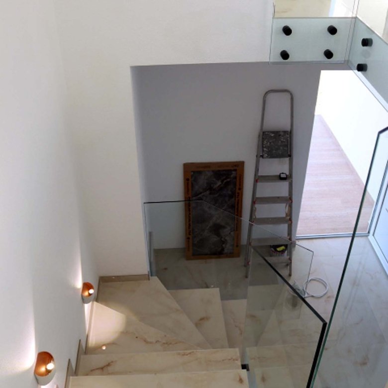 Stunning modern staircase with marble steps, glass railings in Adana Villa&mdash;exclusive Ulcinj real estate by immorenta.me.