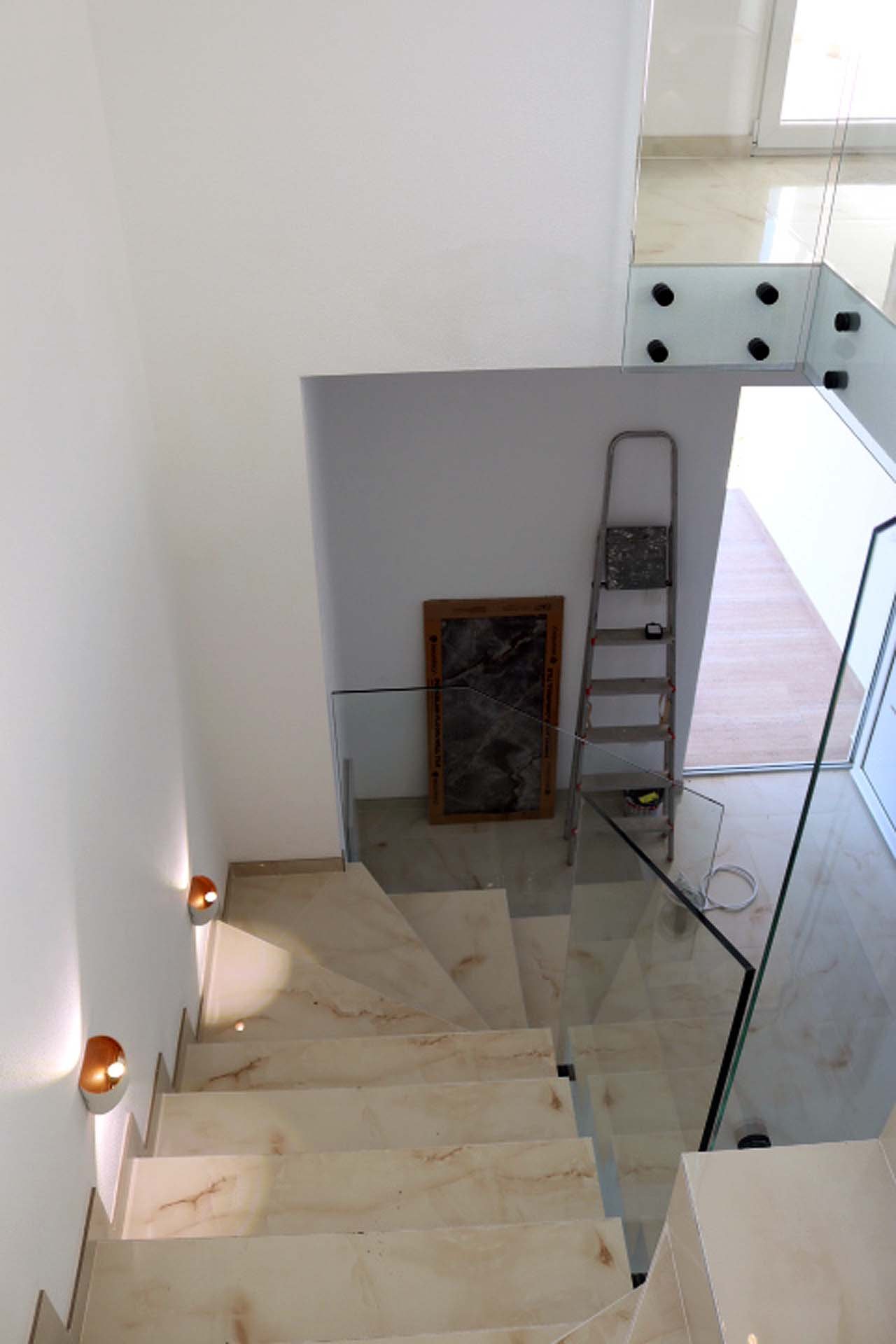 Stunning modern staircase with marble steps, glass railings in Adana Villa&mdash;exclusive Ulcinj real estate by immorenta.me.
