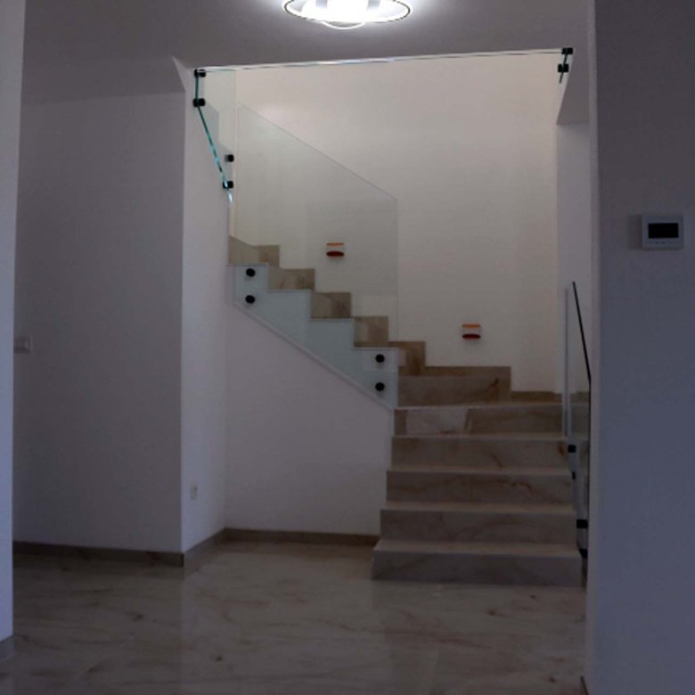 Elegant marble staircase with glass railings in Adana Villa, Ulcinj; bright, modern design&mdash;prime Montenegro investment via ekosphere doo.