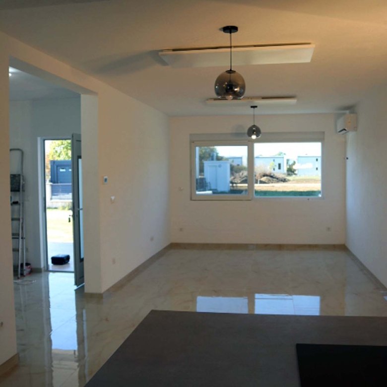 Spacious modern room in Adana Villa, Ulcinj&mdash;large windows, designer tile, open layout. Exclusive at immorenta.me by ekosphere doo.