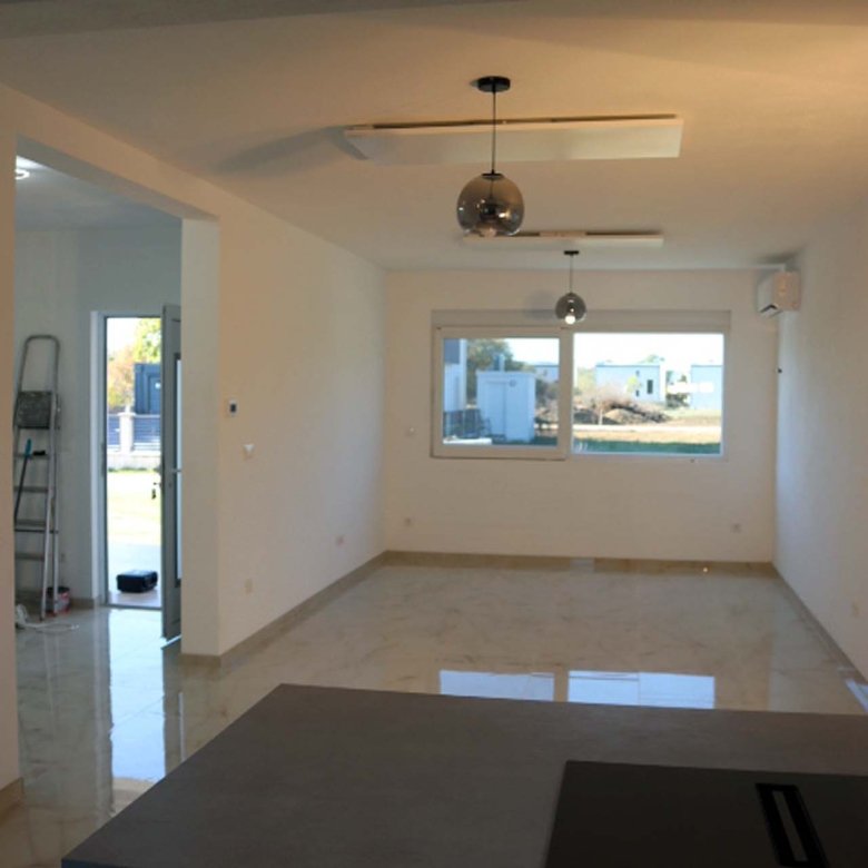 Spacious Adana Villa in Ulcinj: tiled floors, bright living room, large windows&mdash;prime Montenegro real estate by ekosphere doo.