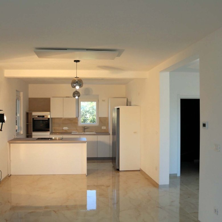 Stunning Adana Villa kitchen in Ulcinj: beige marble floors, island, premium appliances&mdash;invest with immorenta.me by ekosphere doo.