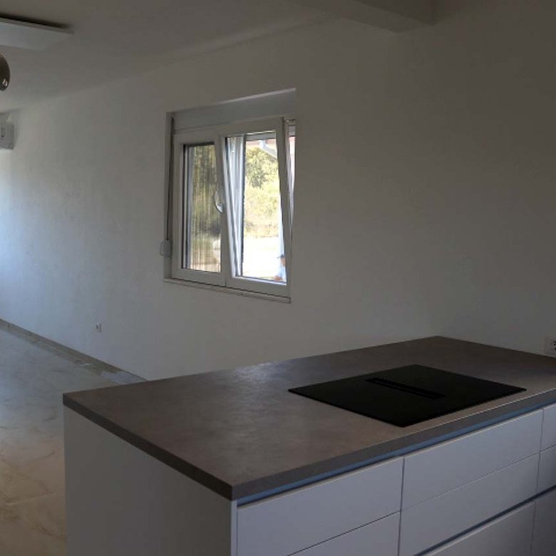 Stunning unfurnished Adana Villa in Ulcinj: bright, tiled floors, large windows, modern kitchen&mdash;prime Montenegro investment via ekosphere doo.