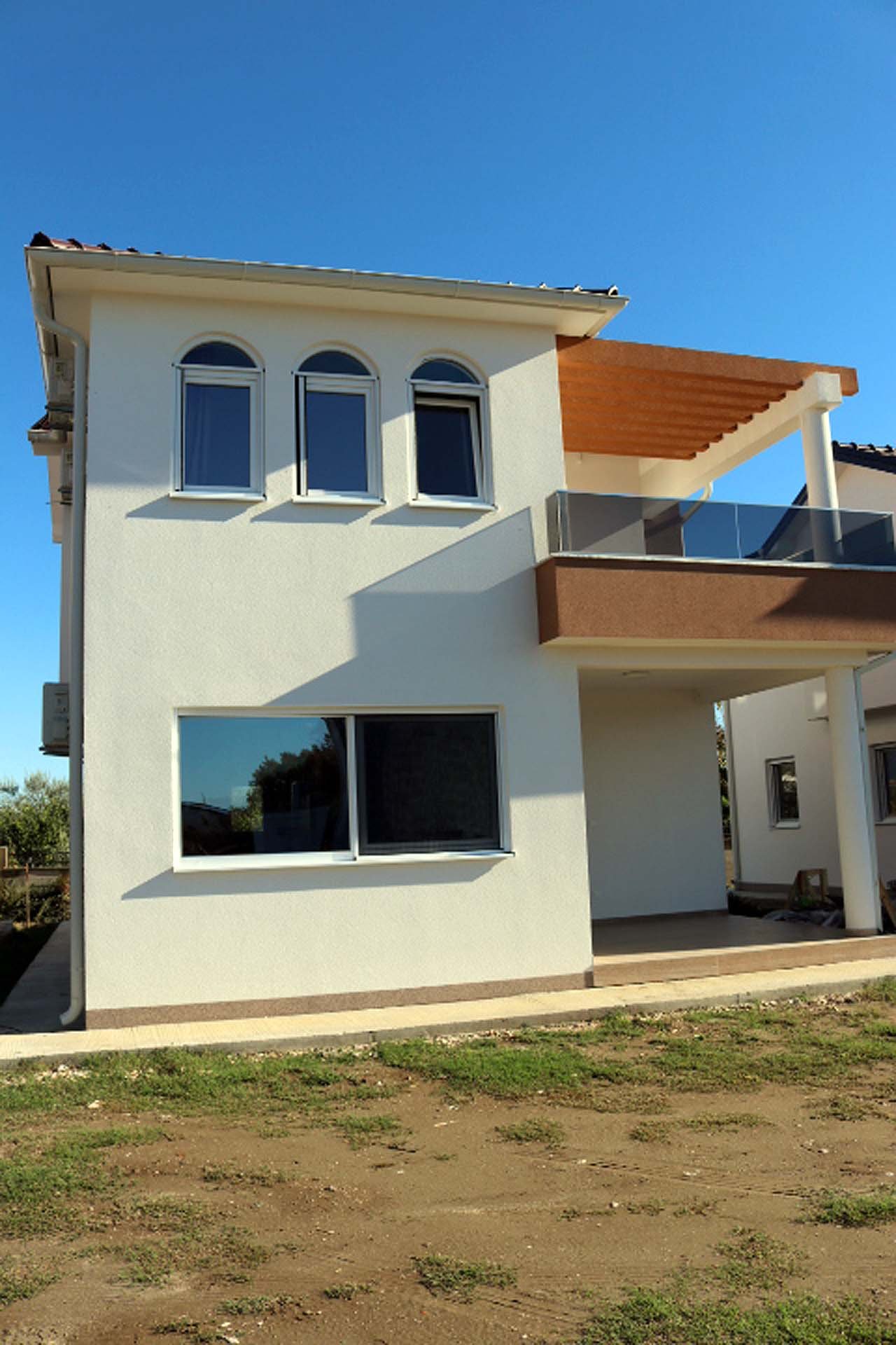 Stunning two-story Adana Villa in Ulcinj, Montenegro&mdash;white fa&ccedil;ade, arched windows, balcony, glass railings, exclusive at immorenta.me by ekosphere doo.