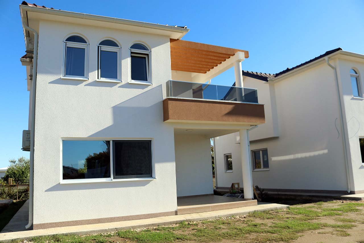 Elegant two-story Adana Villa in Ulcinj, Montenegro with balcony, pergola, arched and rectangular windows&mdash;exclusive at immorenta.me by ekosphere doo.