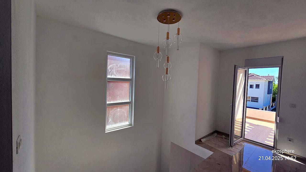 Modern stairwell with white walls, ceiling light, balcony access and Ulcinj views&mdash;ideal property on immorenta.me by ekosphere doo.