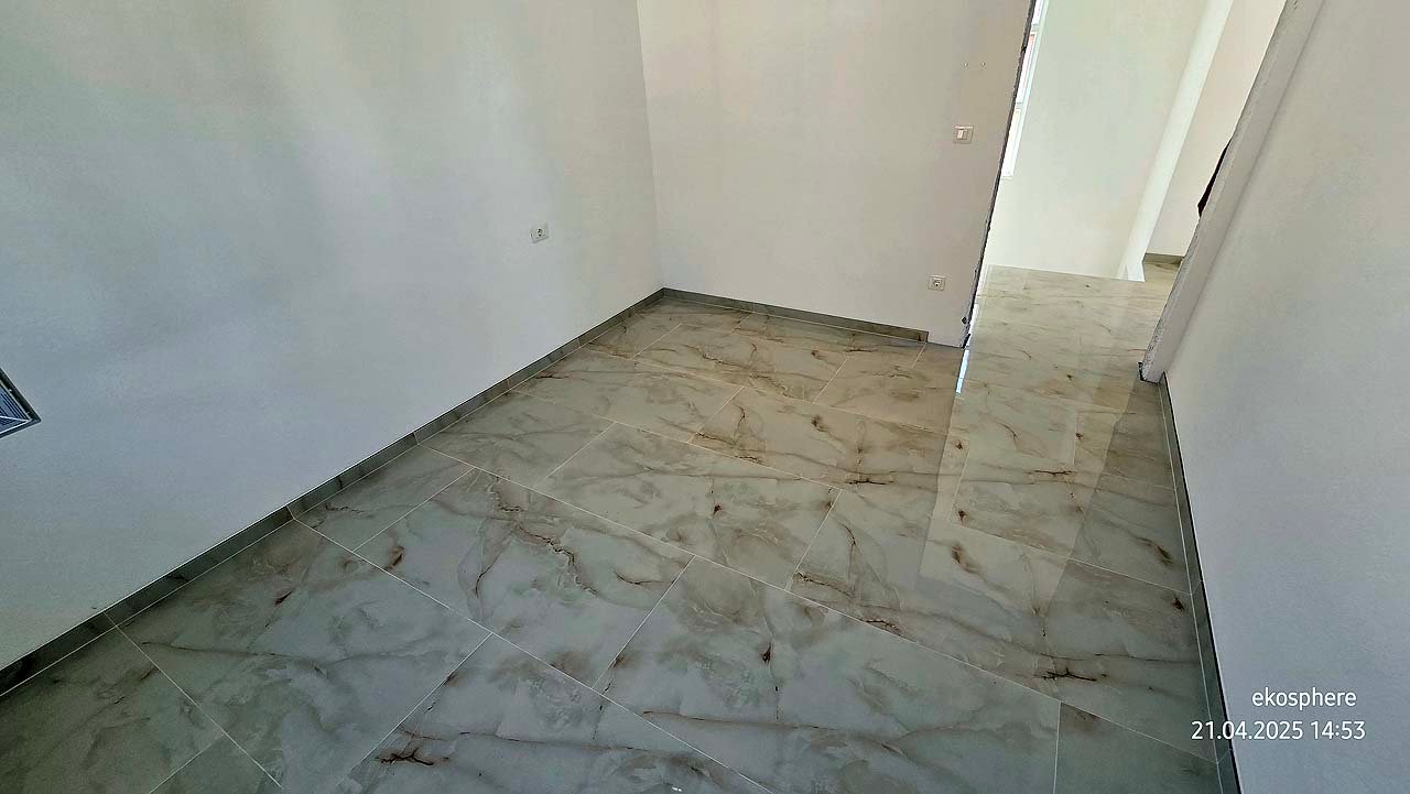 Bright, spacious room with marble floors and white walls in Ulcinj&mdash;prime Montenegro real estate by ekosphere doo on immorenta.me.