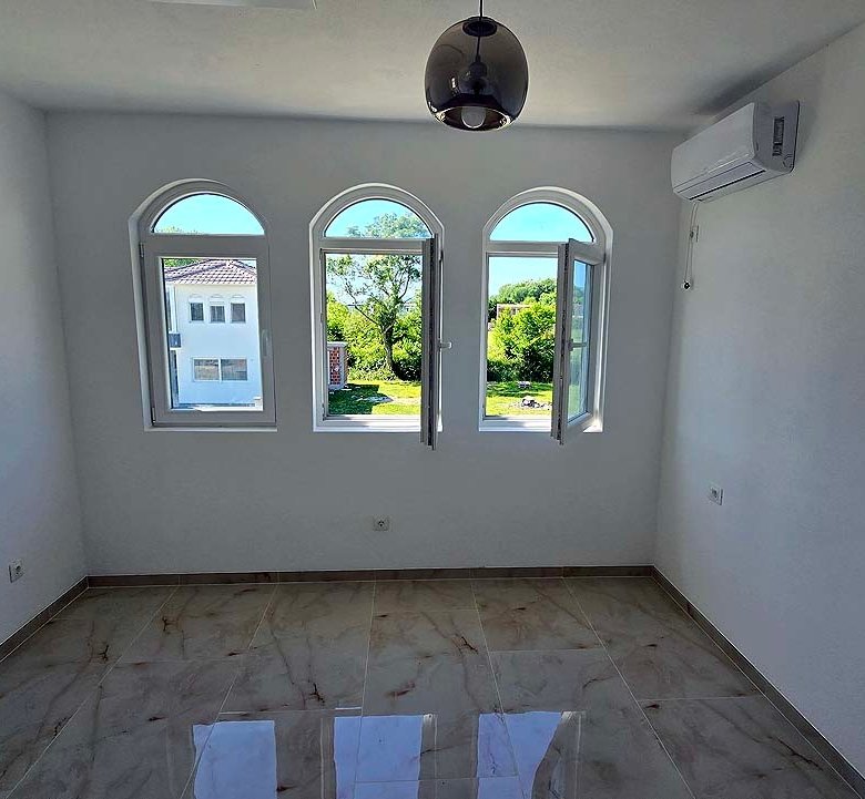 Bright, investment-ready room in Ulcinj, Montenegro with arched windows, views, AC; exclusive to immorenta.me by ekosphere doo.