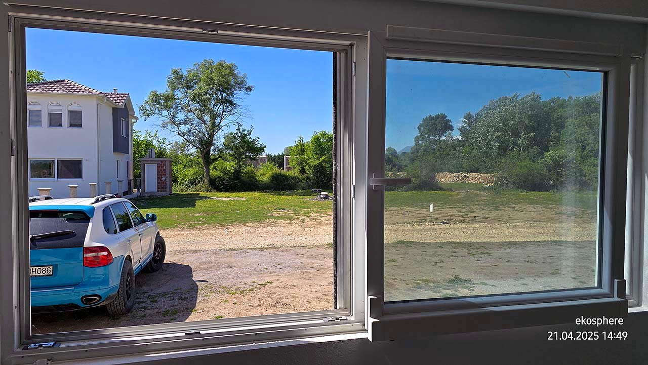 Spacious Ulcinj property: bright windows, white house, green trees, and SUV&mdash;prime Montenegro investment by EkoSphere Doo.