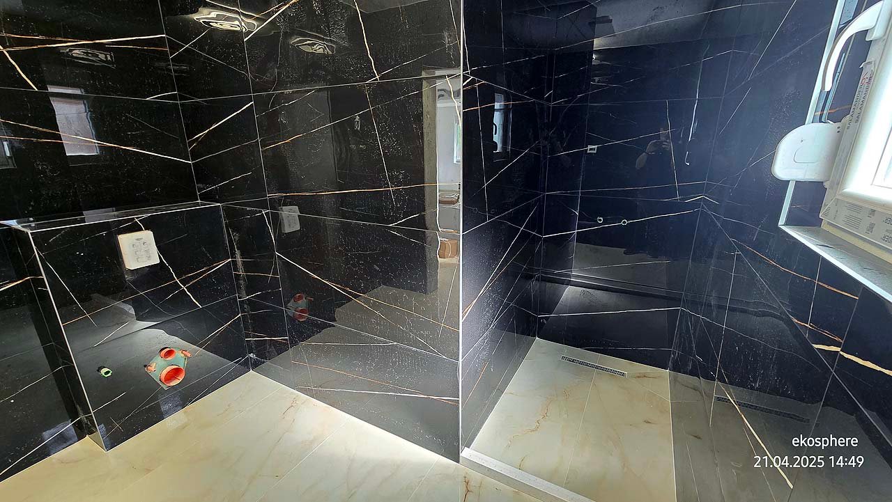 Luxury bathroom in Ulcinj: black marble walls, bright marble floors, walk-in shower, sunny window. Exclusive at immorenta.me by Ekosphere doo.