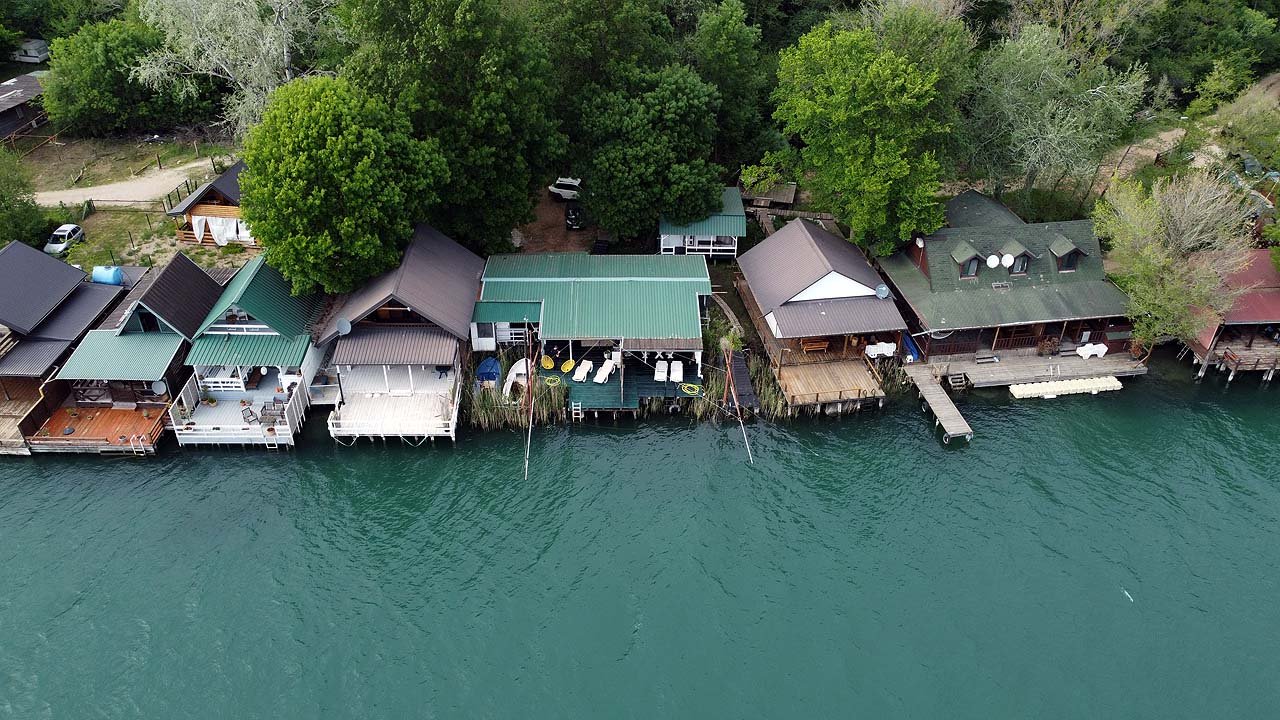 Prime Ulcinj real estate: waterfront homes, private docks, lush greenery. Invest via immorenta.me by Ekosphere DOO.