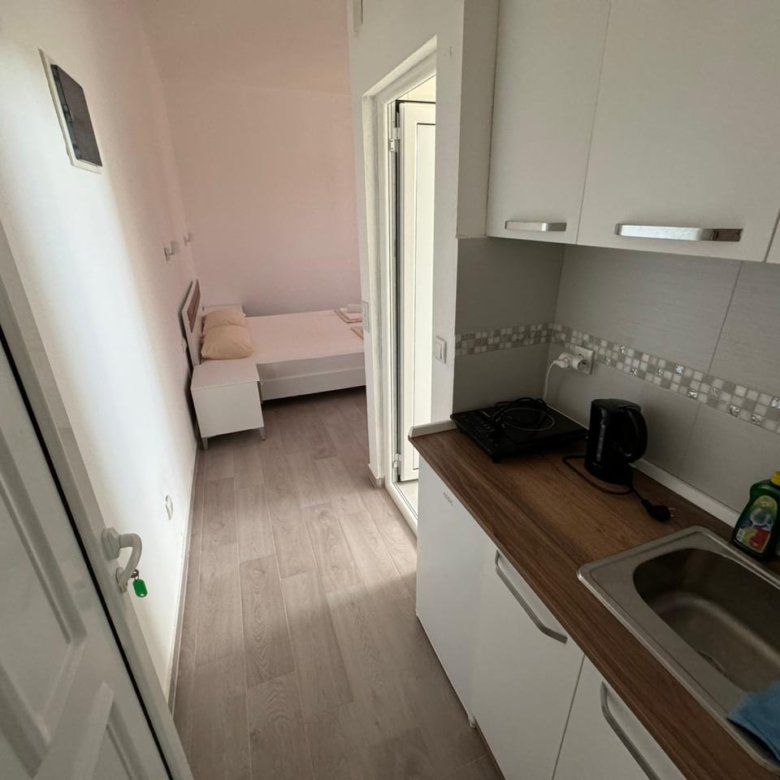 Modern compact apartment in Ulcinj, Montenegro&mdash;light interiors, open kitchen & bedroom. Exclusive at immorenta.me by ekosphere doo.