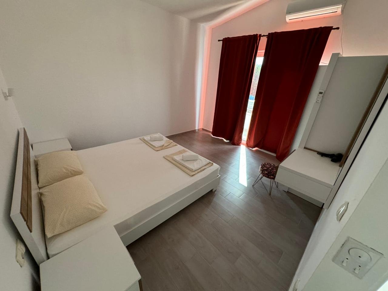 Modern minimalist bedroom in Ulcinj, Montenegro&acirc;double bed, AC, wardrobe. Prime real estate by ekosphere doo at immorenta.me.