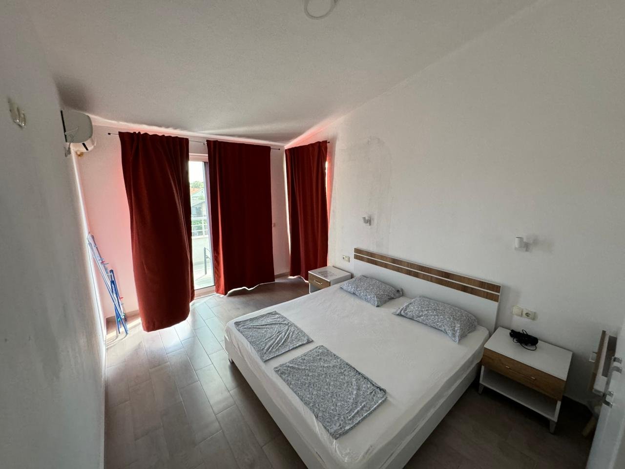 Modern hotel room in Ulcinj, Montenegro, with double bed, wood floors&acirc;ideal real estate investment by ekosphere doo via immorenta.me.