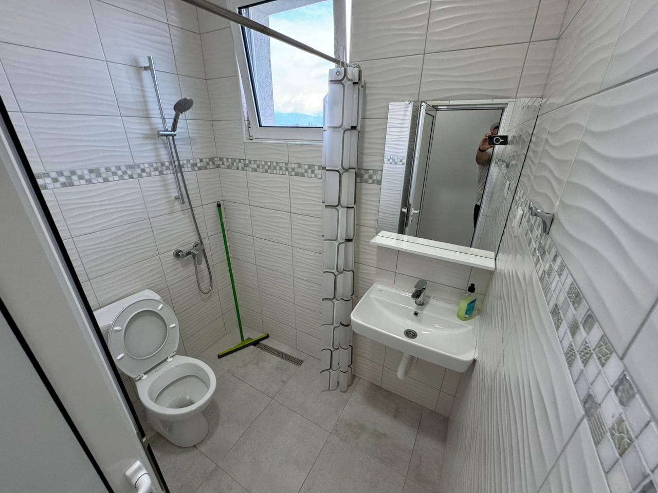 Modern tiled bathroom in Ulcinj property: toilet, sink, shower; bright space&acirc;ideal Montenegro investment. Via immorenta.me (ekosphere doo).