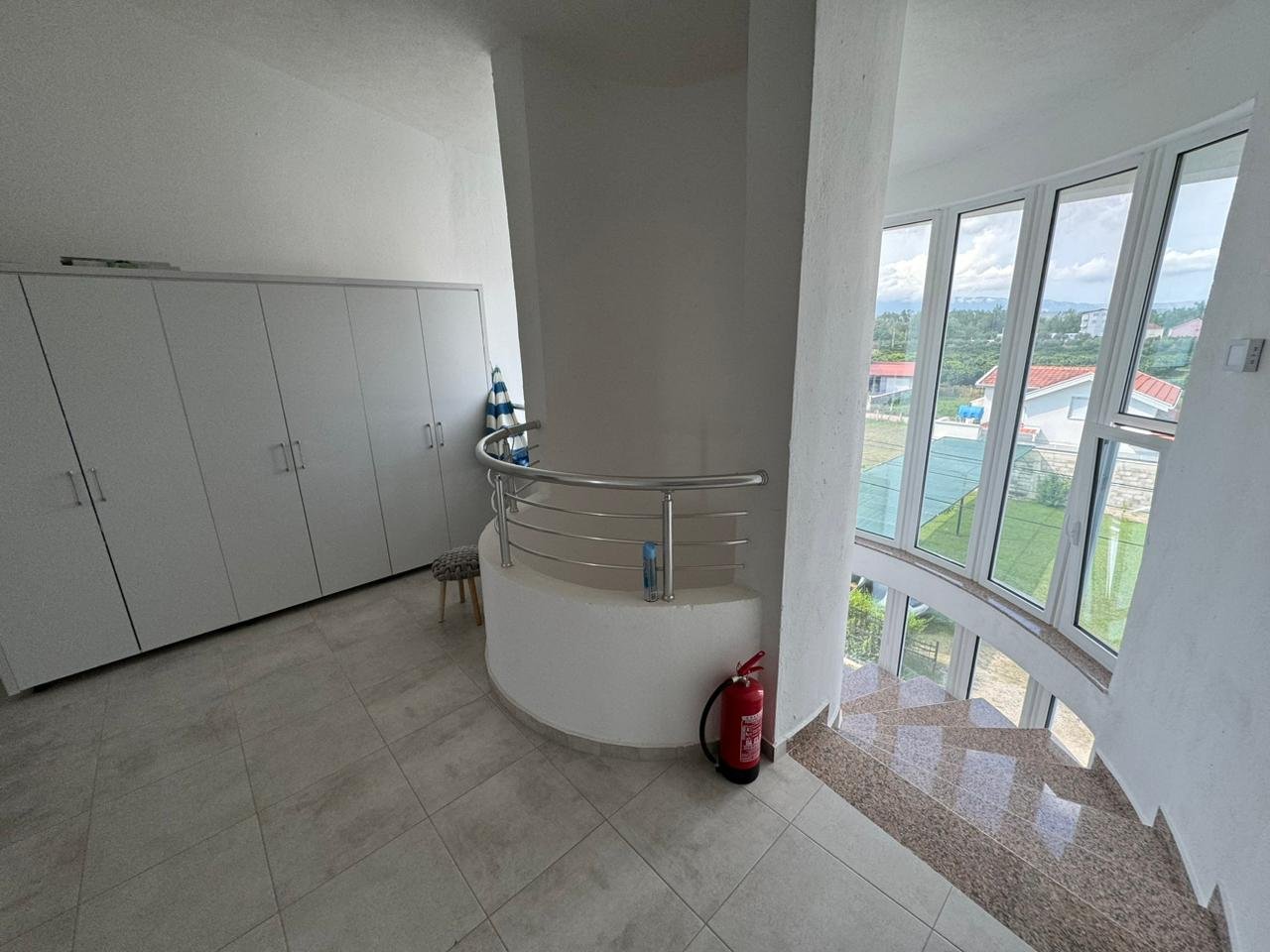 Spacious, light-filled Ulcinj room with white walls, modern wardrobe, and stylish staircase&acirc;premium Ekosphere DOO design at immorenta.me.