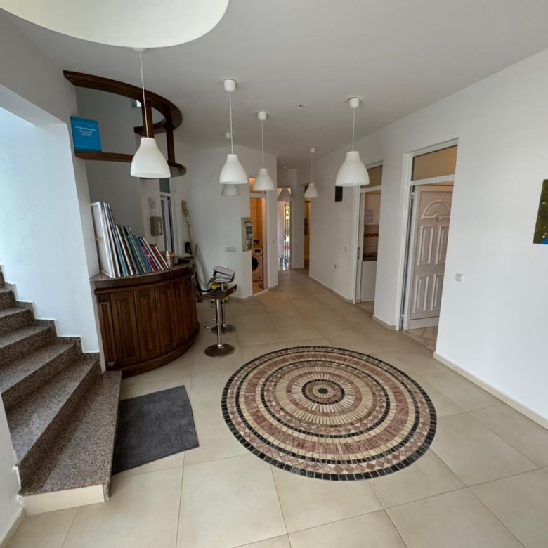 Elegant bright hallway in Ulcinj, Montenegro with mosaic tiles, stylish staircase&mdash;prime real estate by Ekosphere on immorenta.me.