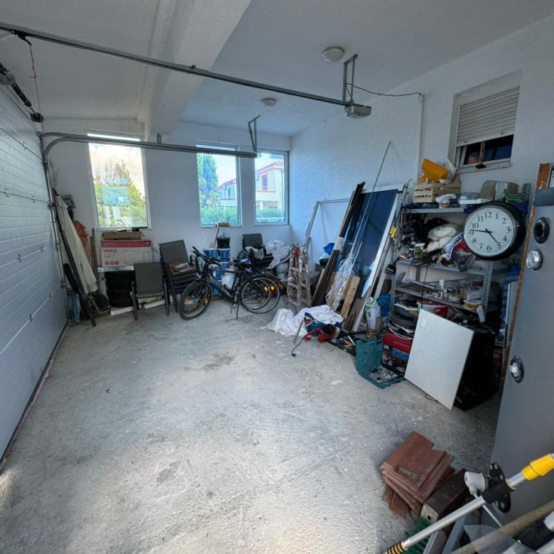 Spacious Ulcinj garage with concrete floor, two windows, and ample storage&mdash;ideal Montenegro investment. Listed by ekosphere doo.