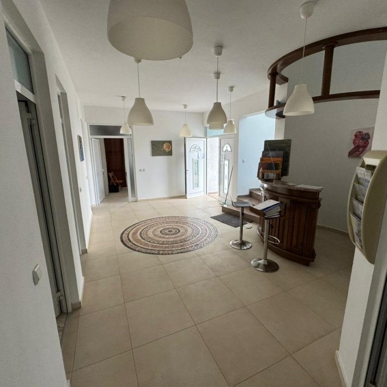 Discover this bright, eco-designed Ulcinj property with elegant beige tiles, pendant lighting, and premium finishes&mdash;immorenta.me by Ekosphere doo.