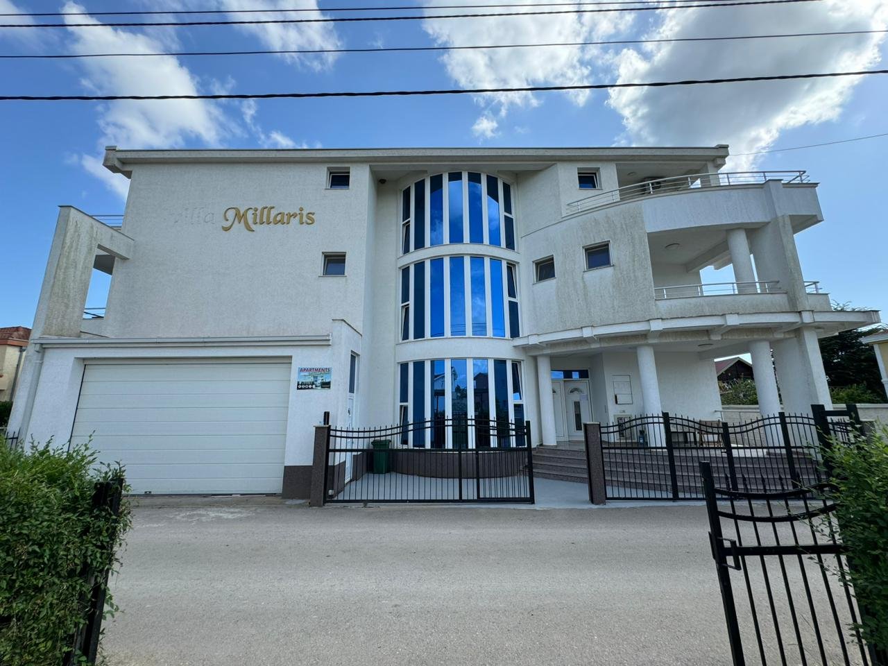 Villa Millaris: Modern 3-story luxury home in Ulcinj, Montenegro with blue-tinted windows, balconies, garage&acirc;exclusive at immorenta.me by ekosphere doo.