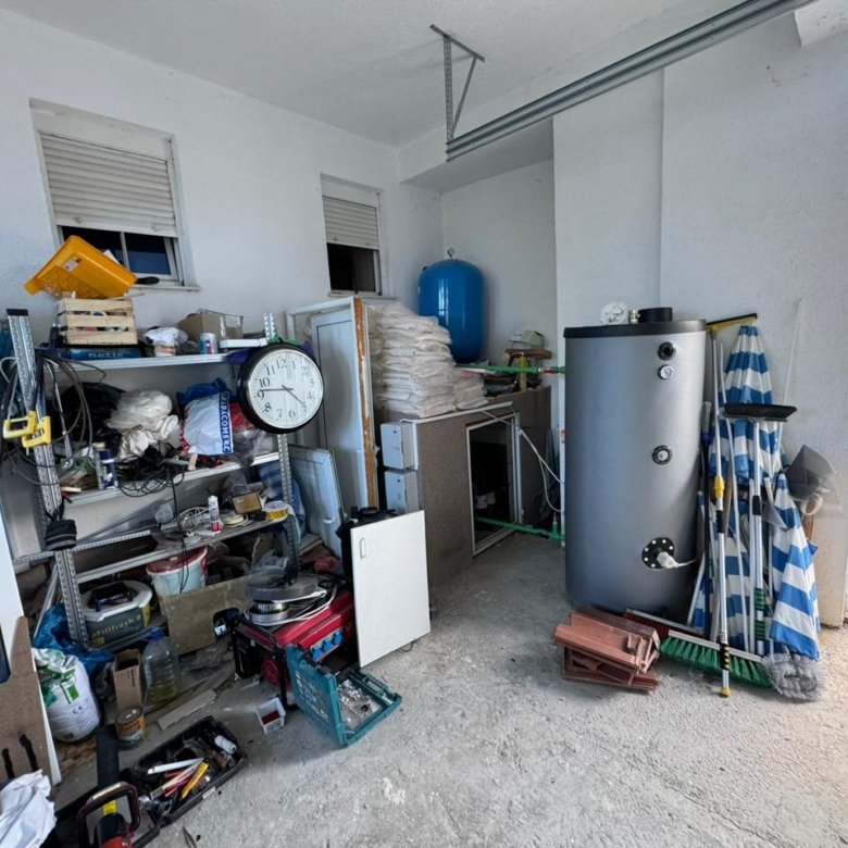 Spacious Ulcinj garage with shelving, storage, and building materials&mdash;an ideal property investment by Ekosphere on immorenta.me.