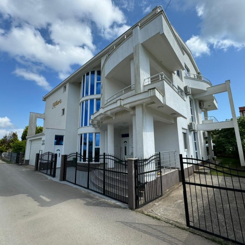 Modern 3-floor white property with blue-tinted windows, balconies, secure fence in Ulcinj&mdash;exclusive on immorenta.me by Ekosphere doo.