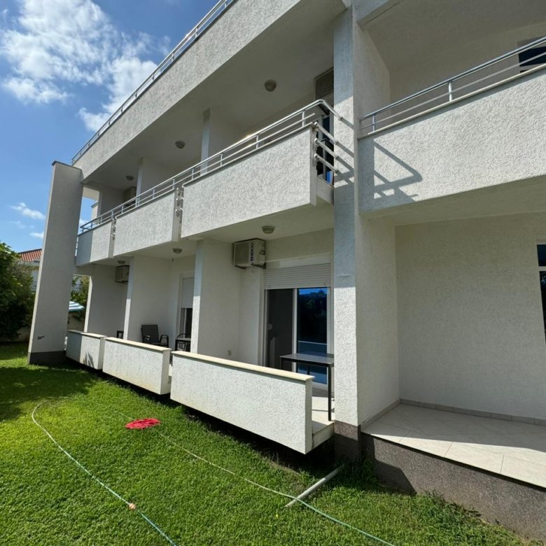 Contemporary 2-floor white property in Ulcinj with sleek balconies, lush lawn&mdash;ideal investment via immorenta.me by ekosphere doo.