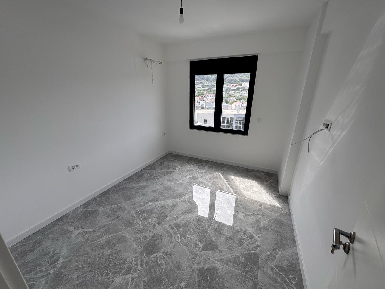 Spacious unfurnished room with city view in Ulcinj; top real estate investment on immorenta.me by Ekosphere doo.