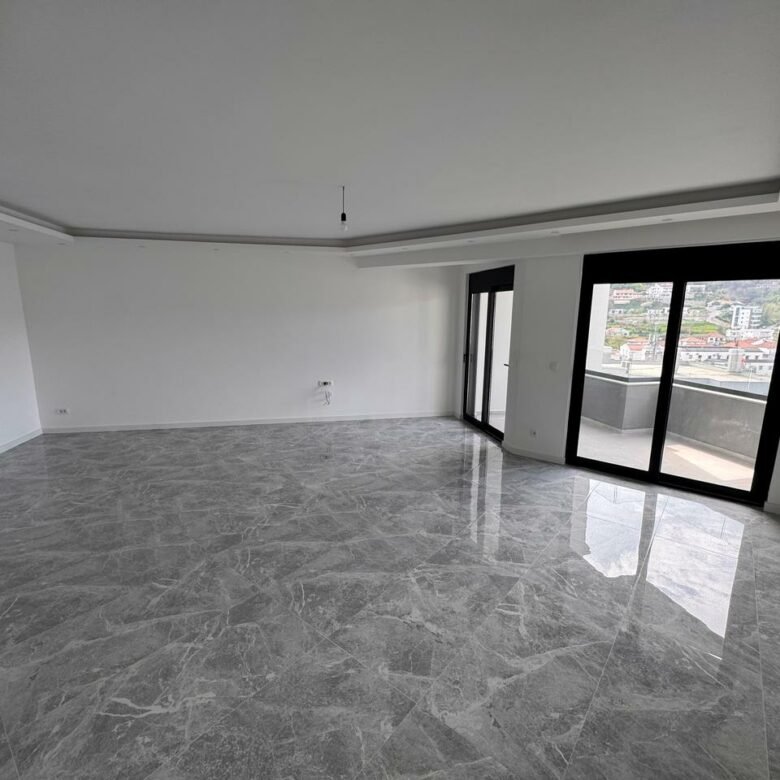 Modern unfurnished room in Ulcinj, Montenegro with marble floors, balcony city view&mdash;prime investment on immorenta.me by ekosphere doo.