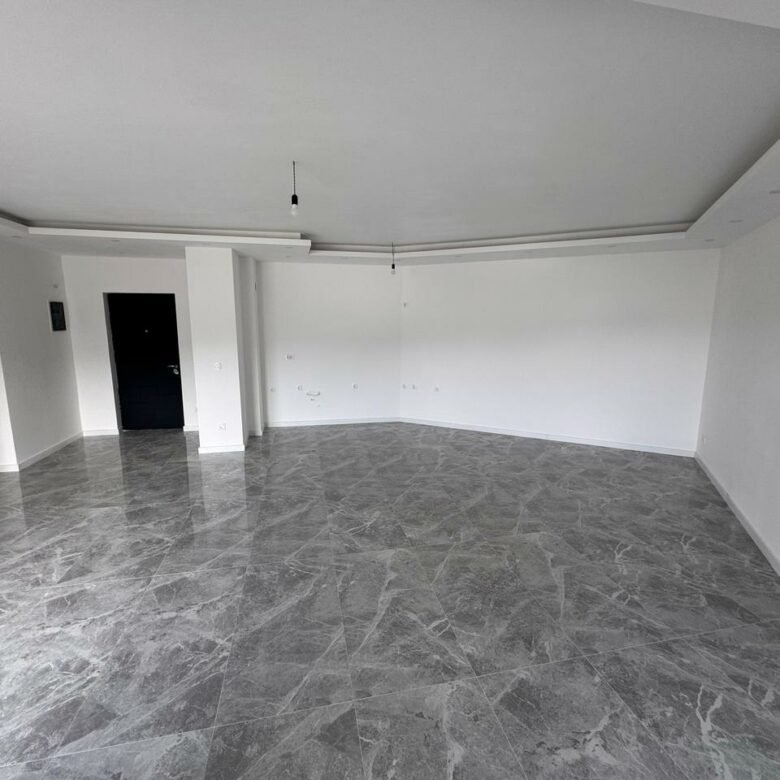 Discover a prime Ulcinj, Montenegro property: modern room with white walls, marbled tiles, & ekosphere style&mdash;exclusive at immorenta.me.