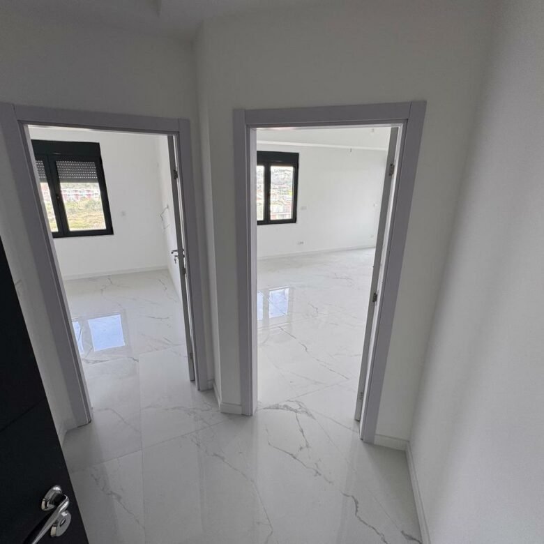 Spacious Ulcinj property: sunlit rooms, modern white interiors, glossy tile floors&mdash;exclusive at immorenta.me by Ekosphere.