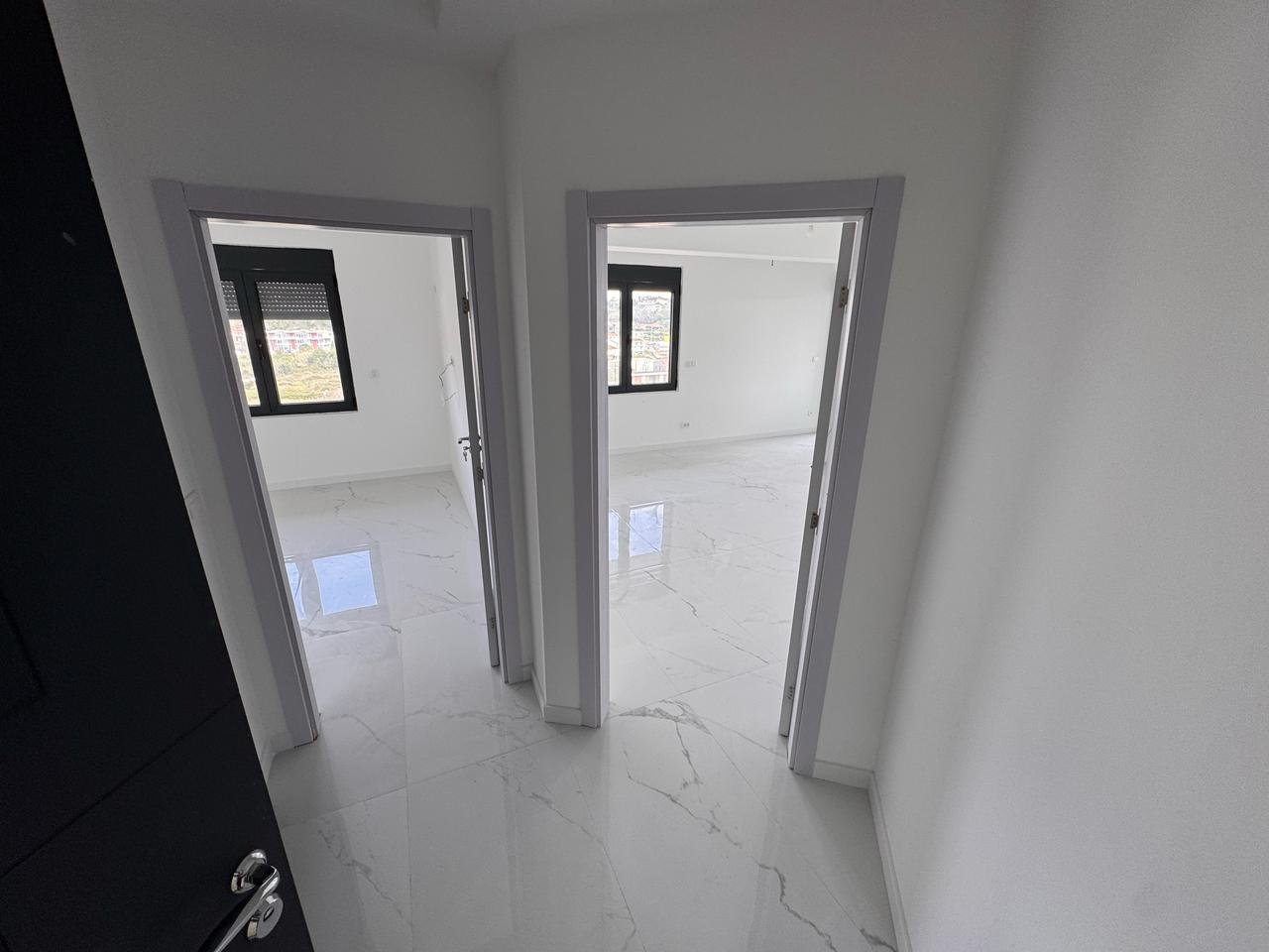 Spacious Ulcinj property: sunlit rooms, modern white interiors, glossy tile floors&mdash;exclusive at immorenta.me by Ekosphere.