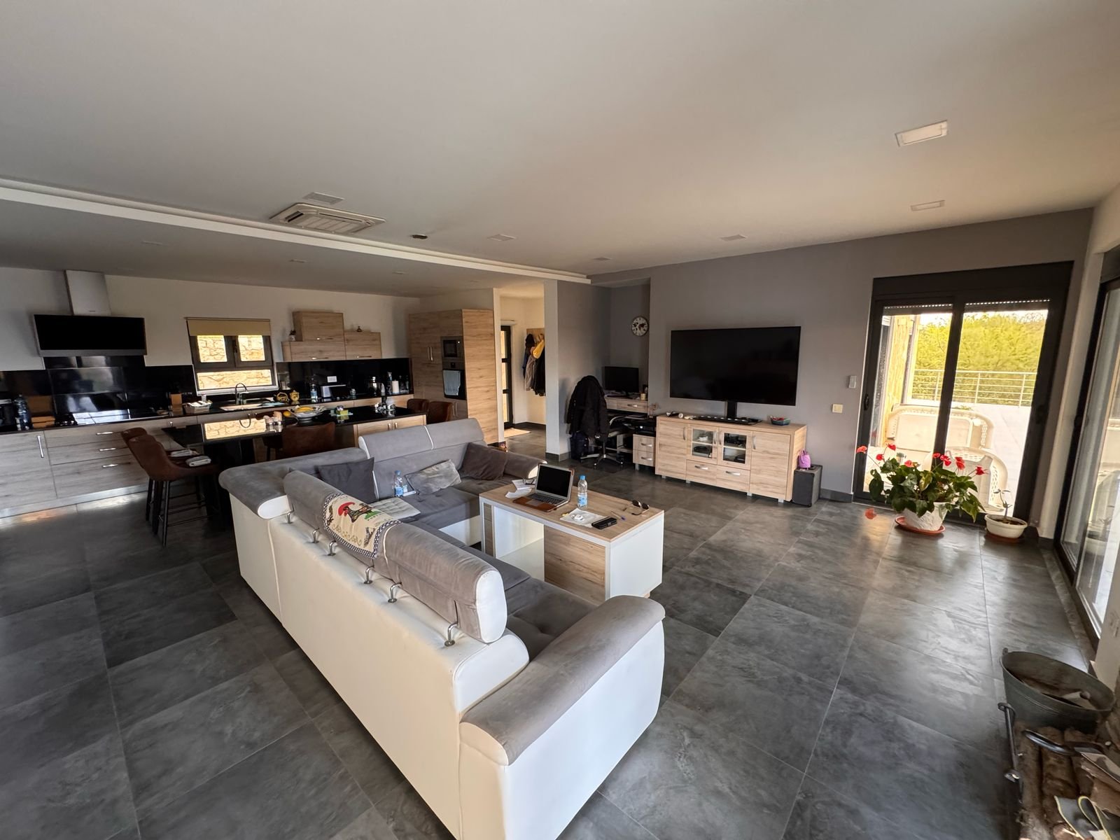 Stunning Ulcinj modern open-plan living with gray tiled floors, elegant sofa, top finishes&mdash;ideal Montenegro investment by ekosphere doo.