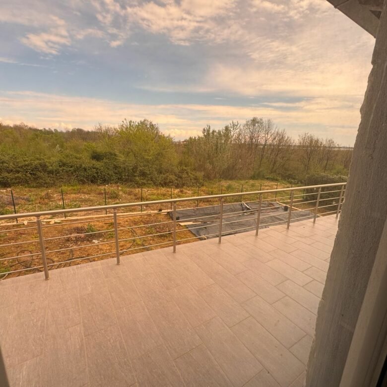 Modern tiled balcony with metal railing, lush greenery views&mdash;exclusive Ulcinj property by immorenta.me, Ekosphere doo project.