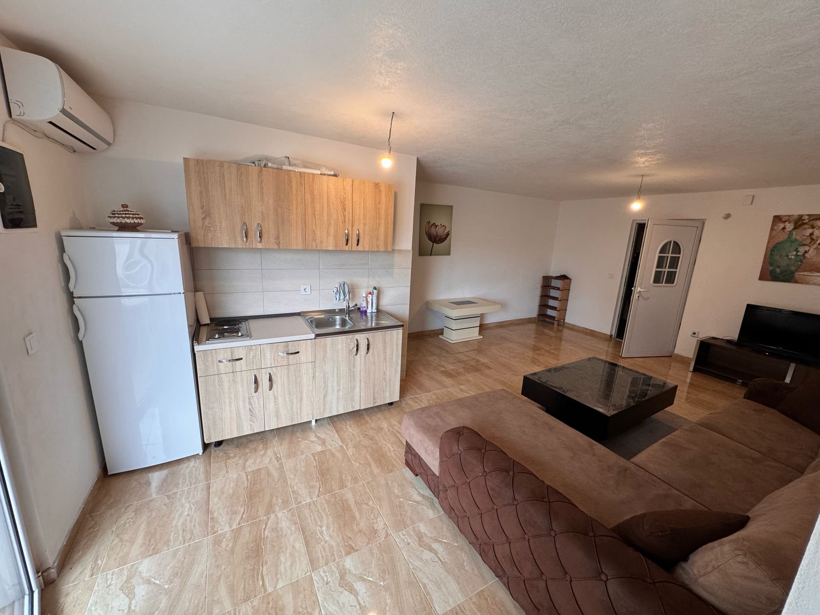 Stunning Ulcinj apartment: tiled floors, modern kitchen, spacious brown sectional&mdash;top investment via immorenta.me by ekosphere doo.