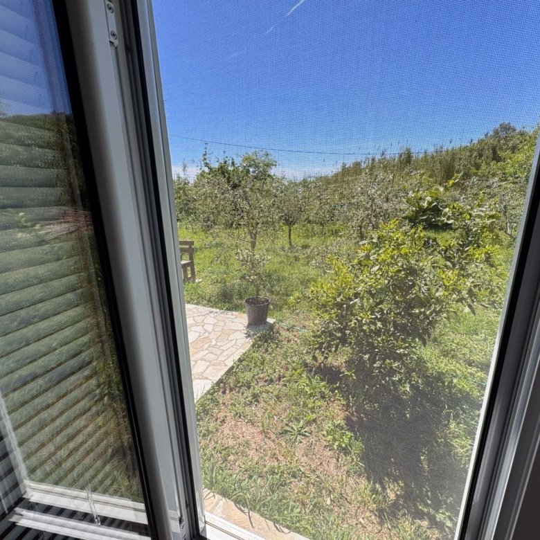 Stunning garden view from stone patio in Ulcinj, Montenegro. Exclusive Ekosphere listing on immorenta.me&mdash;prime investment!.