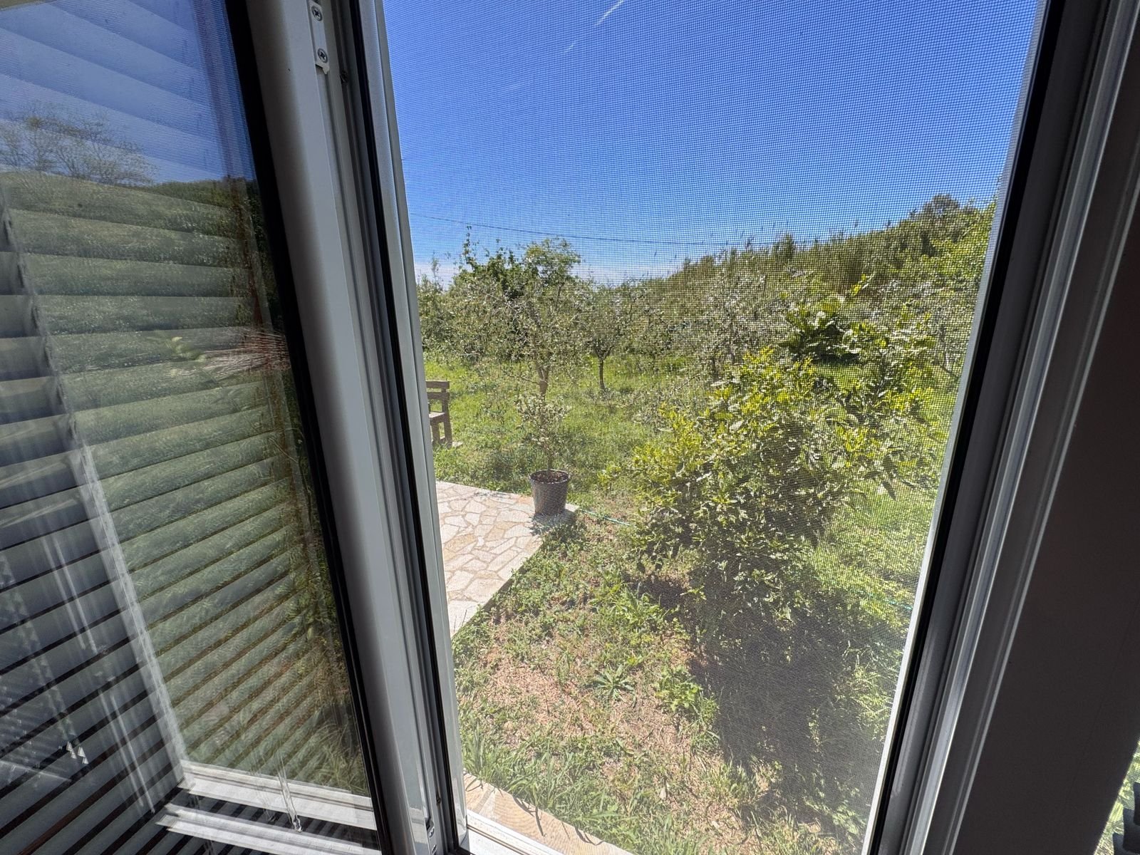 Stunning garden view from stone patio in Ulcinj, Montenegro. Exclusive Ekosphere listing on immorenta.me&mdash;prime investment!.